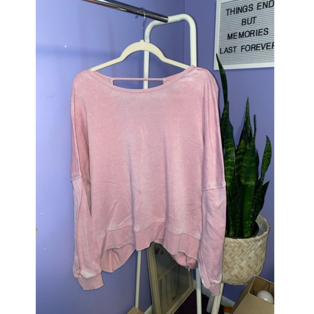 Pink sweater with an open back